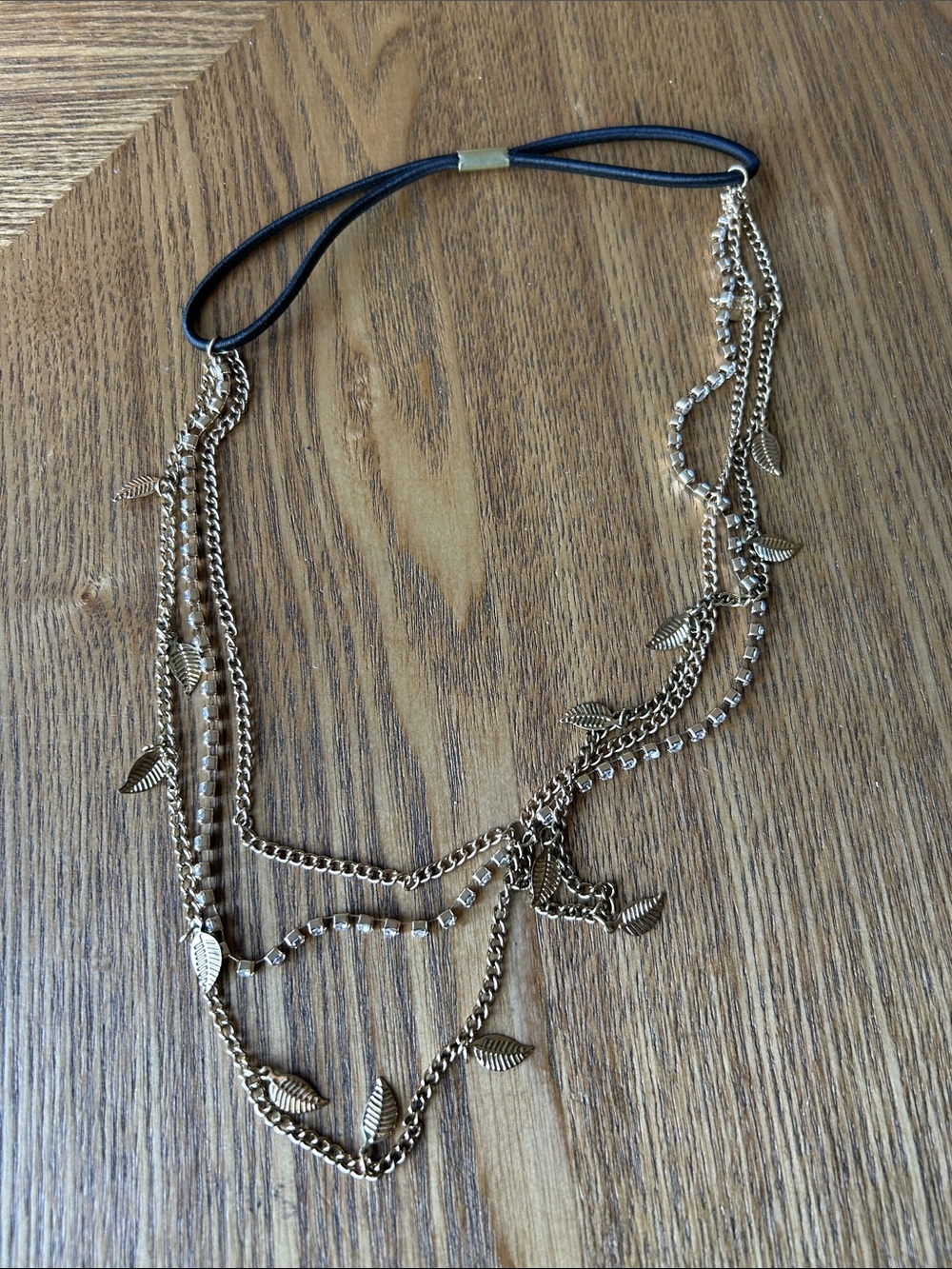 Gold-colored hair accessories with a leaf design.